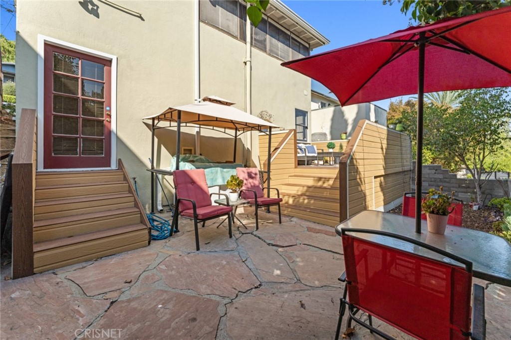 2452 Riverside Place Los Angeles, CA 90039 - Photo 13 of 13 a view of a tables and chairs under an umbrella