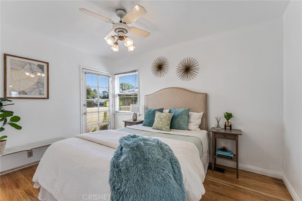 2452 Riverside Place Los Angeles, CA 90039 - Photo 8 of 13 a bedroom with a bed and a chandelier