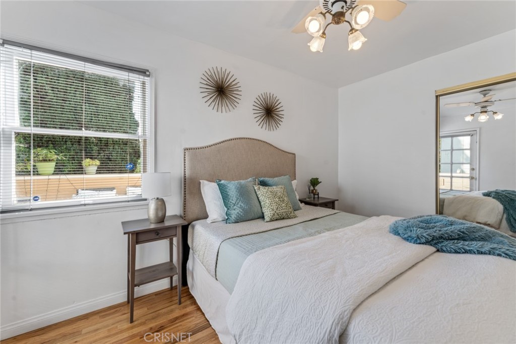 2452 Riverside Place Los Angeles, CA 90039 - Photo 9 of 13 a bedroom with a large bed and a large window