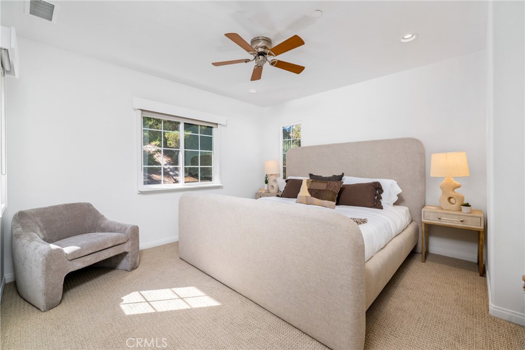 140 White Flower Irvine, CA 92603 - Photo 11 of 44 a bed room with a bed and a couch