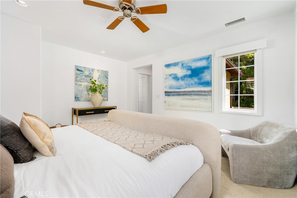 140 White Flower Irvine, CA 92603 - Photo 12 of 44 a bedroom with a bed and wooden floor