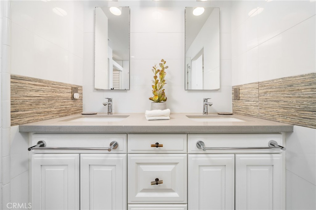 140 White Flower Irvine, CA 92603 - Photo 13 of 44 a bathroom with a sink and a mirror
