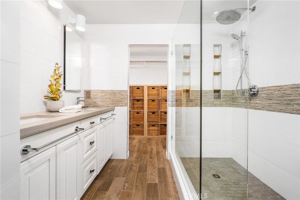 140 White Flower Irvine, CA 92603 - Photo 14 of 44 a spacious bathroom with a double vanity sink and a mirror