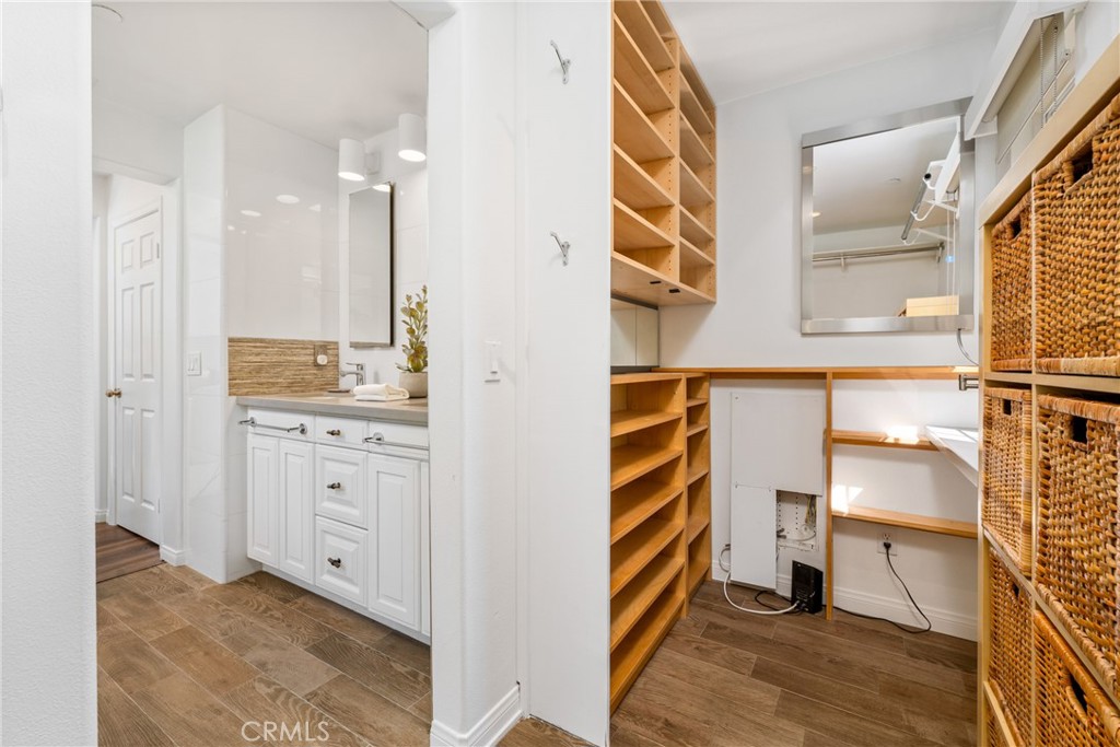 140 White Flower Irvine, CA 92603 - Photo 15 of 44 a view of walk in closet and bathroom