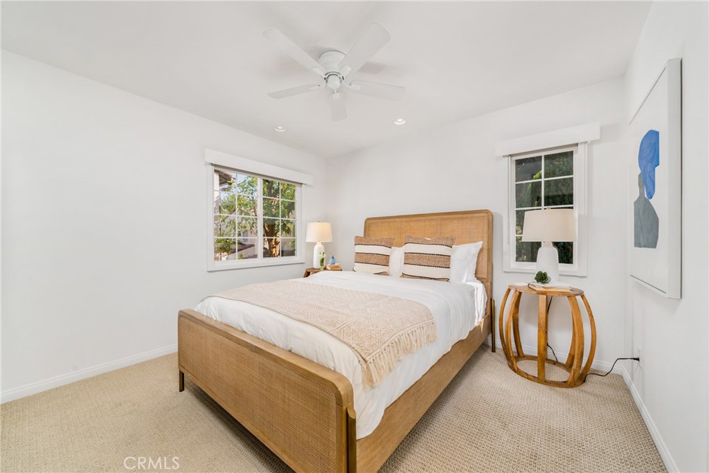 140 White Flower Irvine, CA 92603 - Photo 16 of 44 a bedroom with a bed and a window