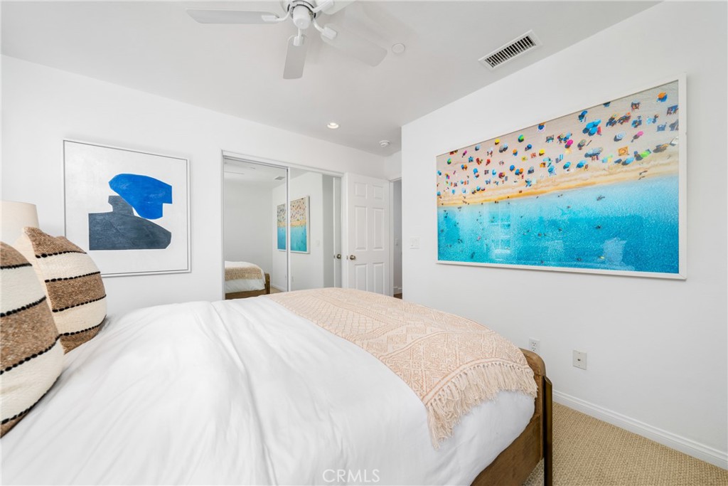140 White Flower Irvine, CA 92603 - Photo 17 of 44 a bedroom with a large bed and a painting on the wall