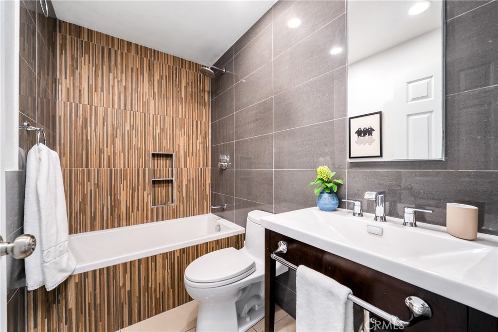 140 White Flower Irvine, CA 92603 - Photo 18 of 44 a bathroom with a sink a toilet and shower