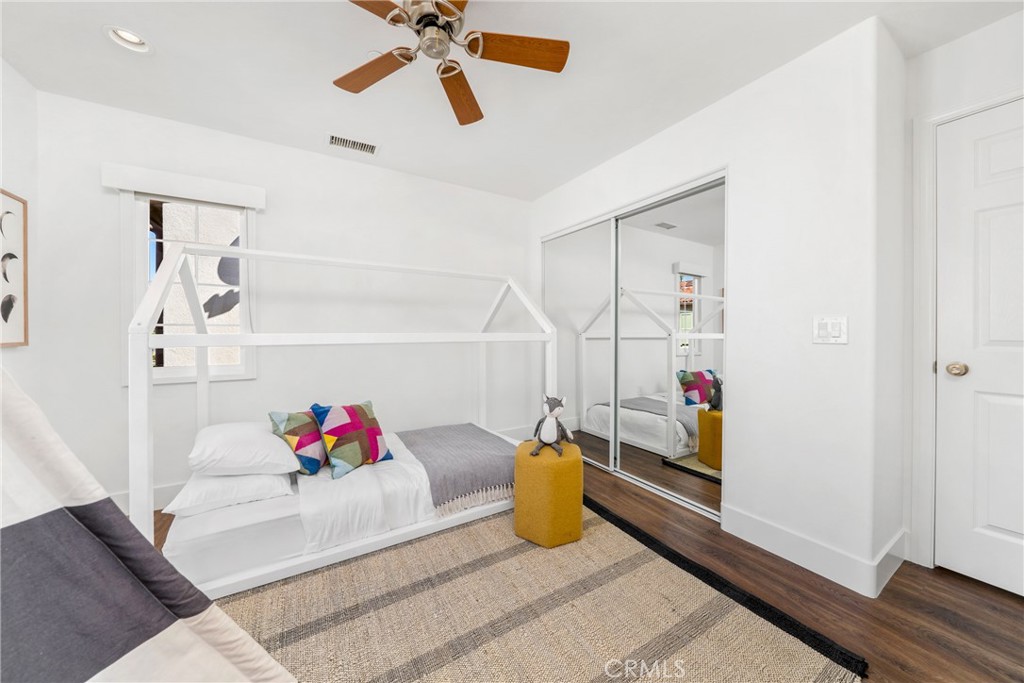 140 White Flower Irvine, CA 92603 - Photo 20 of 44 a bedroom with furniture and a chandelier fan