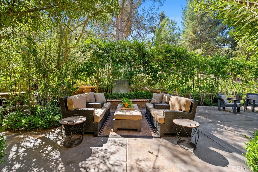 140 White Flower Irvine, CA 92603 - Photo 23 of 44 a view of a patio with table and chairs and potted plants