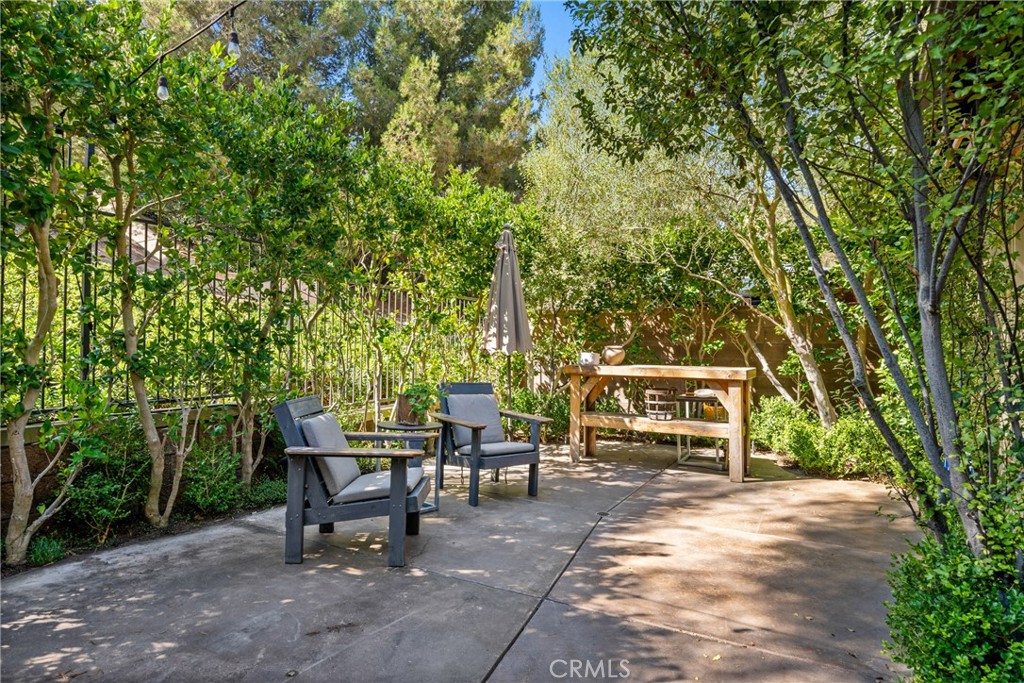 140 White Flower Irvine, CA 92603 - Photo 24 of 44 a view of a bench in a backyard