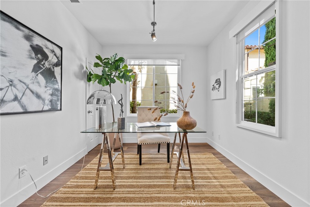 140 White Flower Irvine, CA 92603 - Photo 5 of 44 a view of a dining room with furniture window and wooden floor