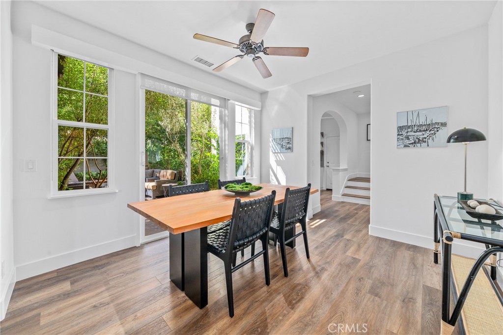 140 White Flower Irvine, CA 92603 - Photo 7 of 44 a dining room with furniture window entryway and wooden floor