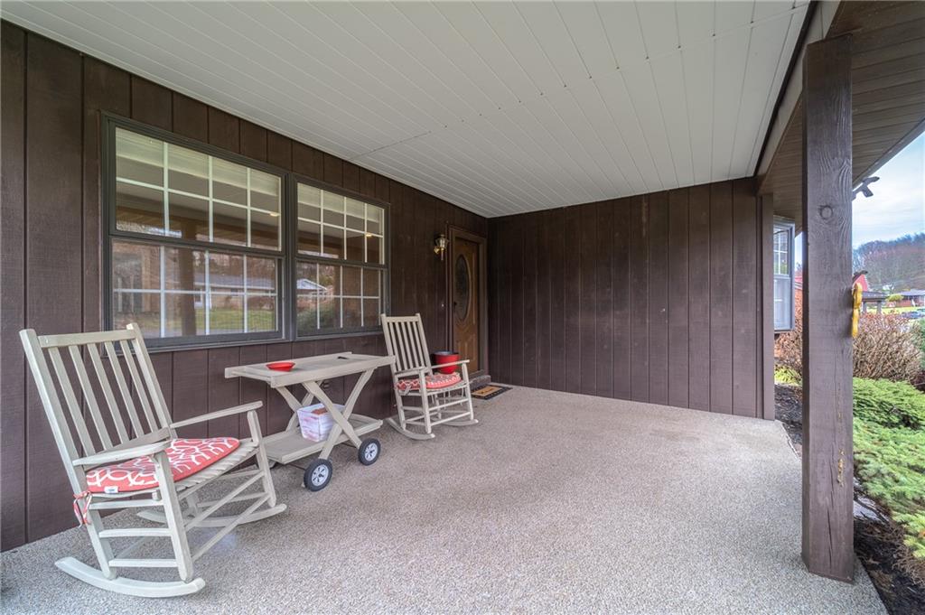 37 Wilson Avenue Cecil, PA 15321 - Photo 3 of 30 Spacious covered front porch with room for outdoor seating—perfect for enjoying your morning coffee or unwinding in the evening shade.