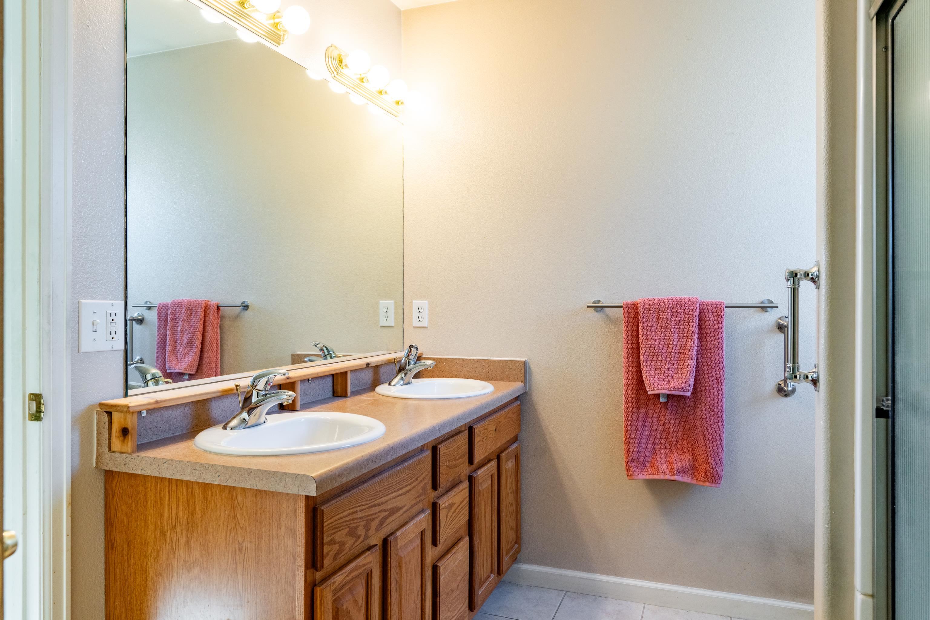 653 Hall Street Fruita, CO 81521 - Photo 20 of 25 a bathroom with a sink and a mirror