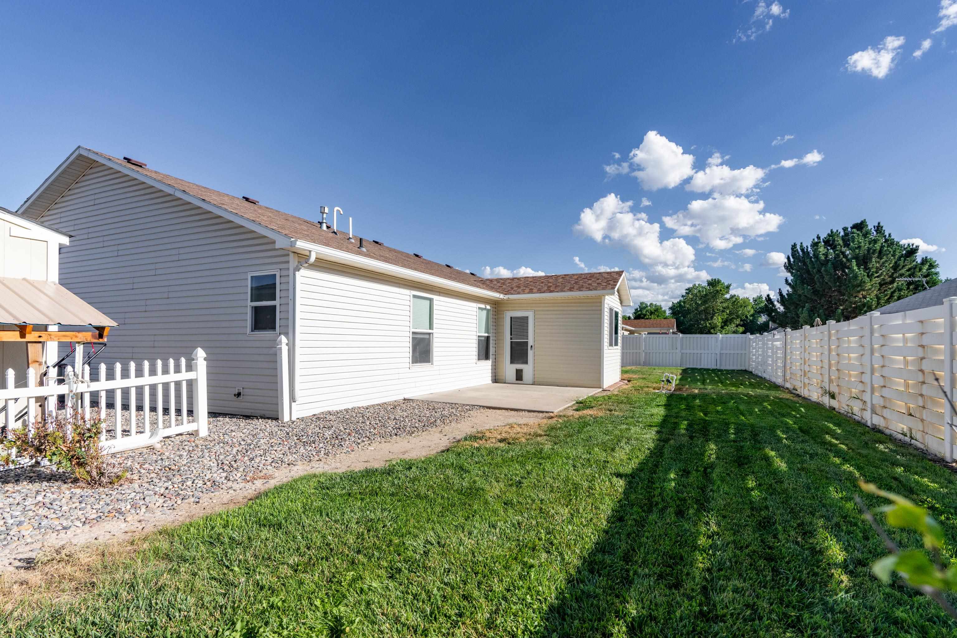 653 Hall Street Fruita, CO 81521 - Photo 24 of 25 a front view of a house with garden