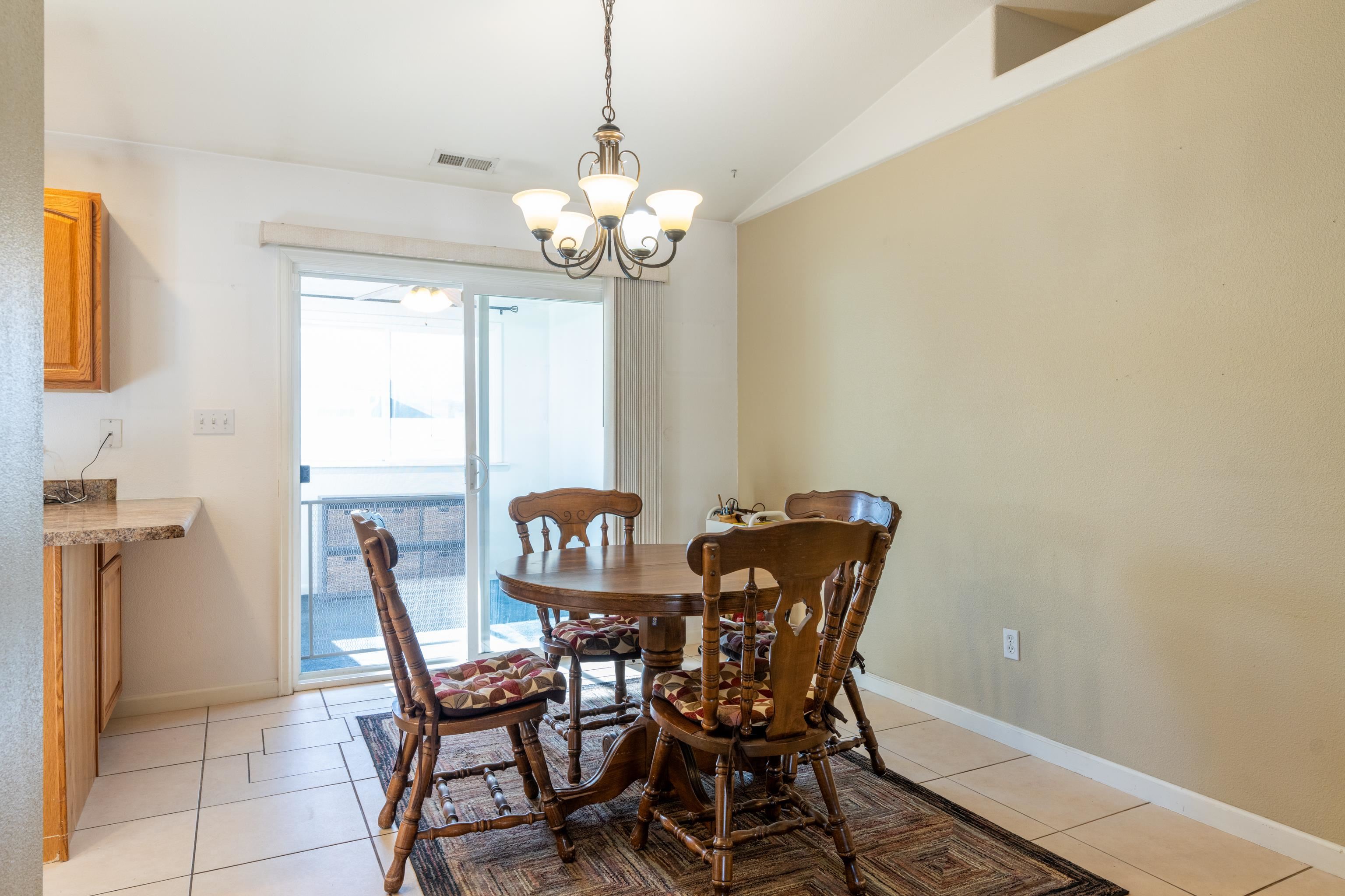 653 Hall Street Fruita, CO 81521 - Photo 7 of 25 a view of a dining room with furniture and chandelier