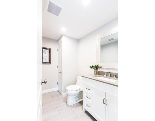 2 Raynor Road Weston, MA 02493 - Photo 15 of 26 a bathroom with a sink a toilet and a mirror