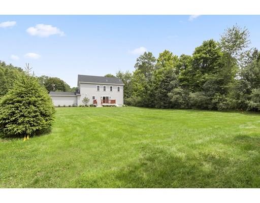 2 Raynor Road Weston, MA 02493 - Photo 3 of 26 a view of a large garden with plants and large trees