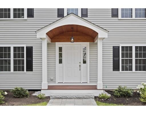 2 Raynor Road Weston, MA 02493 - Photo 6 of 26 a front view of a house with garage
