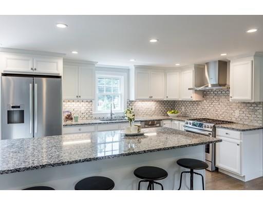 2 Raynor Road Weston, MA 02493 - Photo 9 of 26 a kitchen with granite countertop kitchen island cabinets and refrigerator