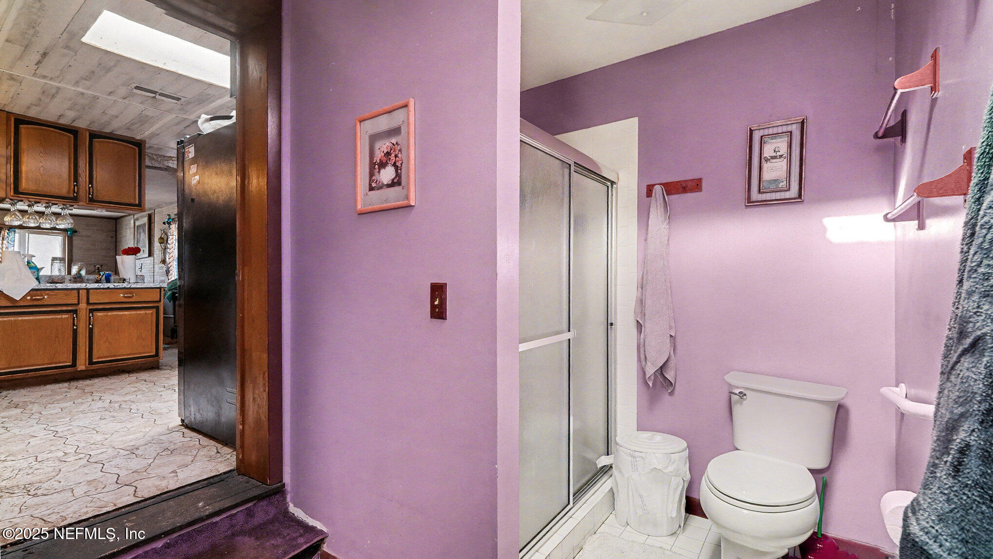 130 Lakeview Way Interlachen, FL 32148 - Photo 16 of 29 a bathroom with a sink a toilet a shower and a mirror