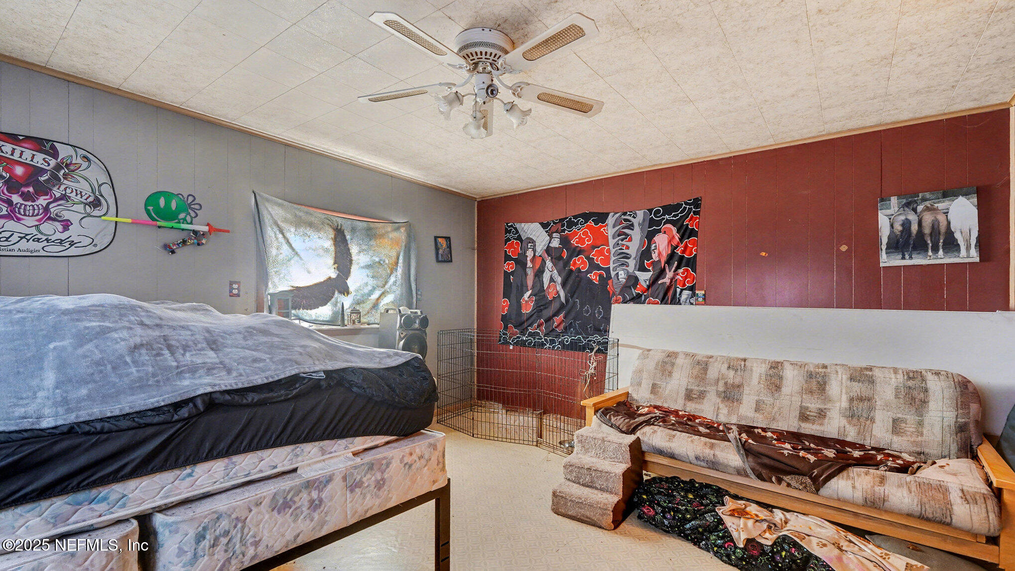 130 Lakeview Way Interlachen, FL 32148 - Photo 24 of 29 a bedroom with a bed and a chandelier