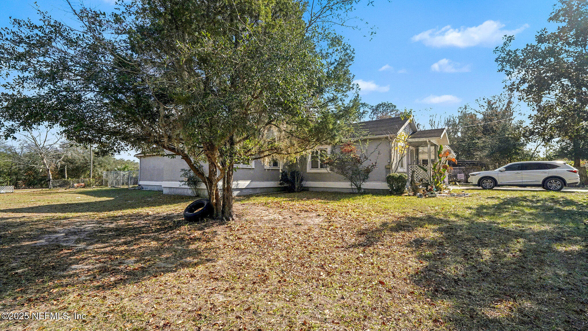 130 Lakeview Way Interlachen, FL 32148 - Photo 27 of 29 a large tree in middle of the garden