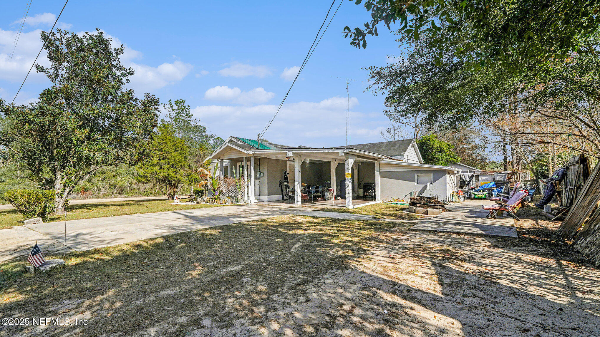130 Lakeview Way Interlachen, FL 32148 - Photo 3 of 29 a front view of a house with a garden