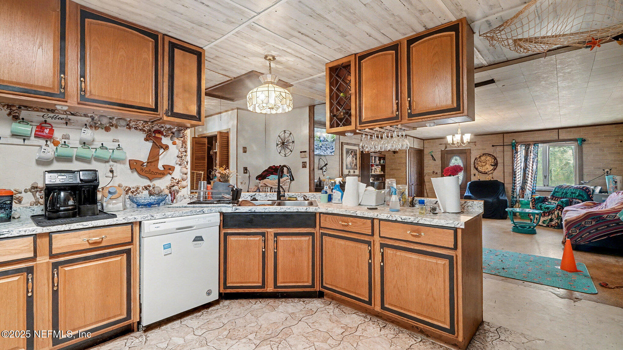 130 Lakeview Way Interlachen, FL 32148 - Photo 7 of 29 a kitchen with stainless steel appliances granite countertop a sink and cabinets