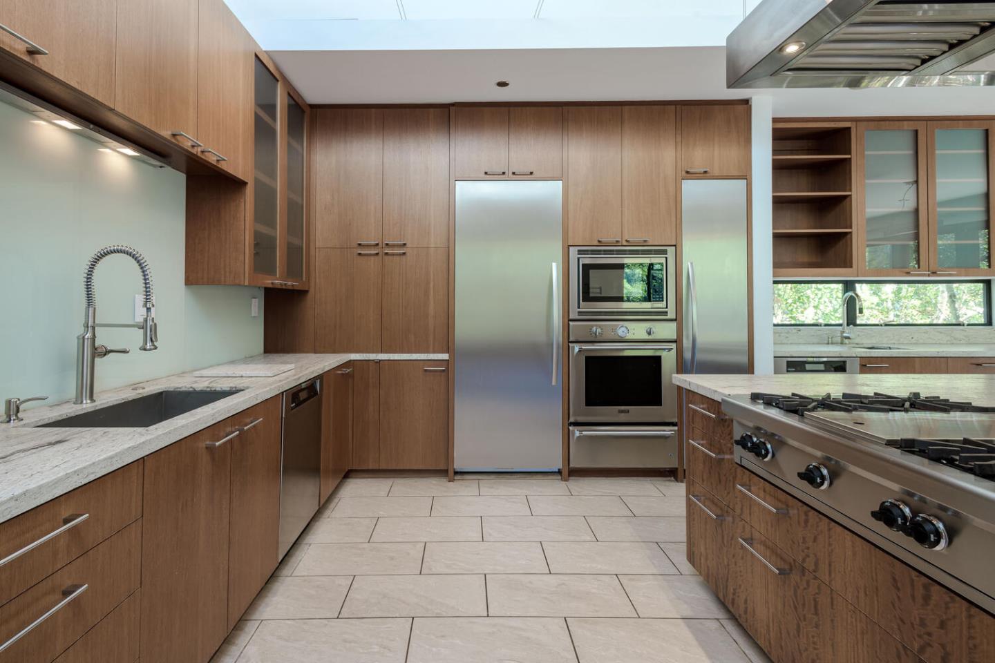 2510 Skyfarm Drive Hillsborough, CA 94010 - Photo 11 of 66 a kitchen with stainless steel appliances granite countertop a stove a sink and a refrigerator