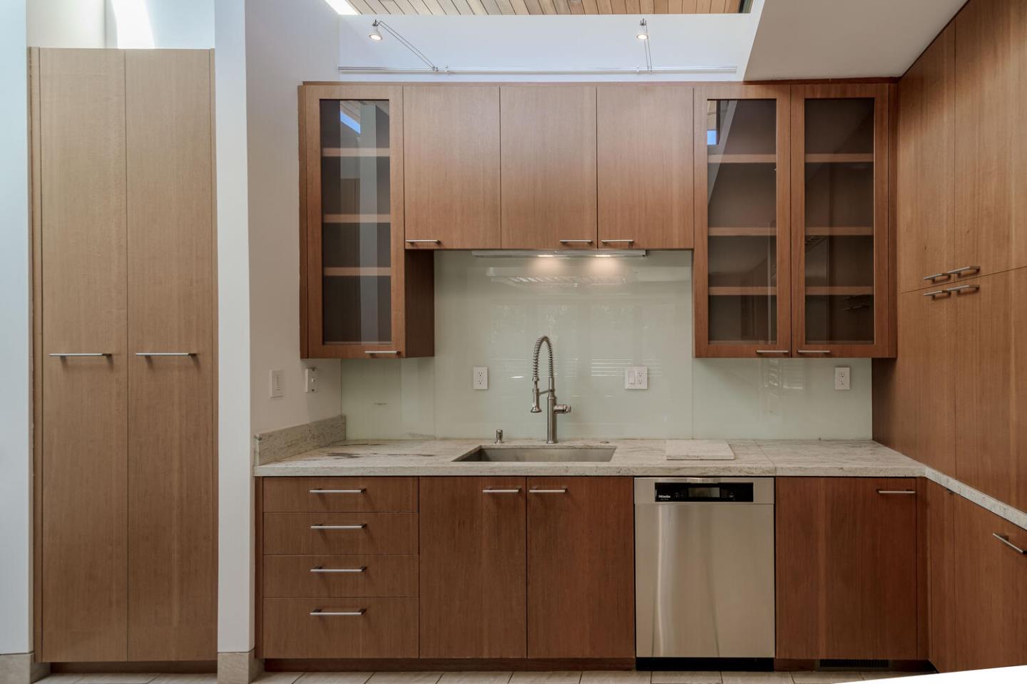 2510 Skyfarm Drive Hillsborough, CA 94010 - Photo 13 of 66 a kitchen with kitchen island a counter top space cabinets and stainless steel appliances