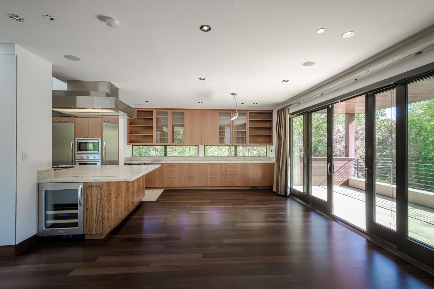 2510 Skyfarm Drive Hillsborough, CA 94010 - Photo 15 of 66 a view of an empty room with wooden floor and a window