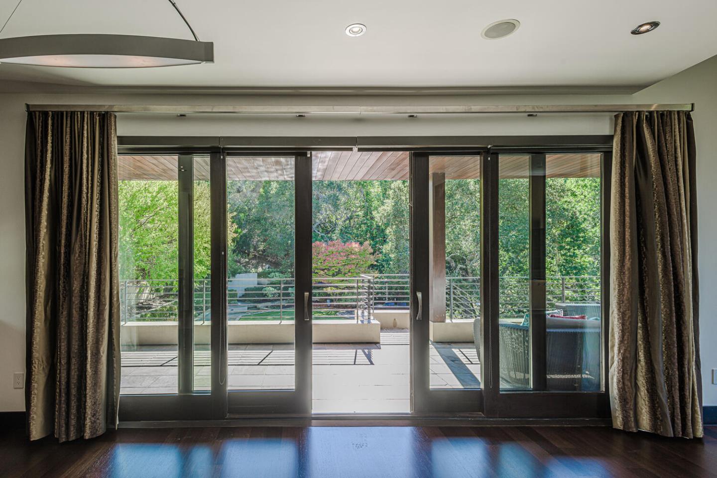 2510 Skyfarm Drive Hillsborough, CA 94010 - Photo 16 of 66 a view of an empty room with wooden floor and a window