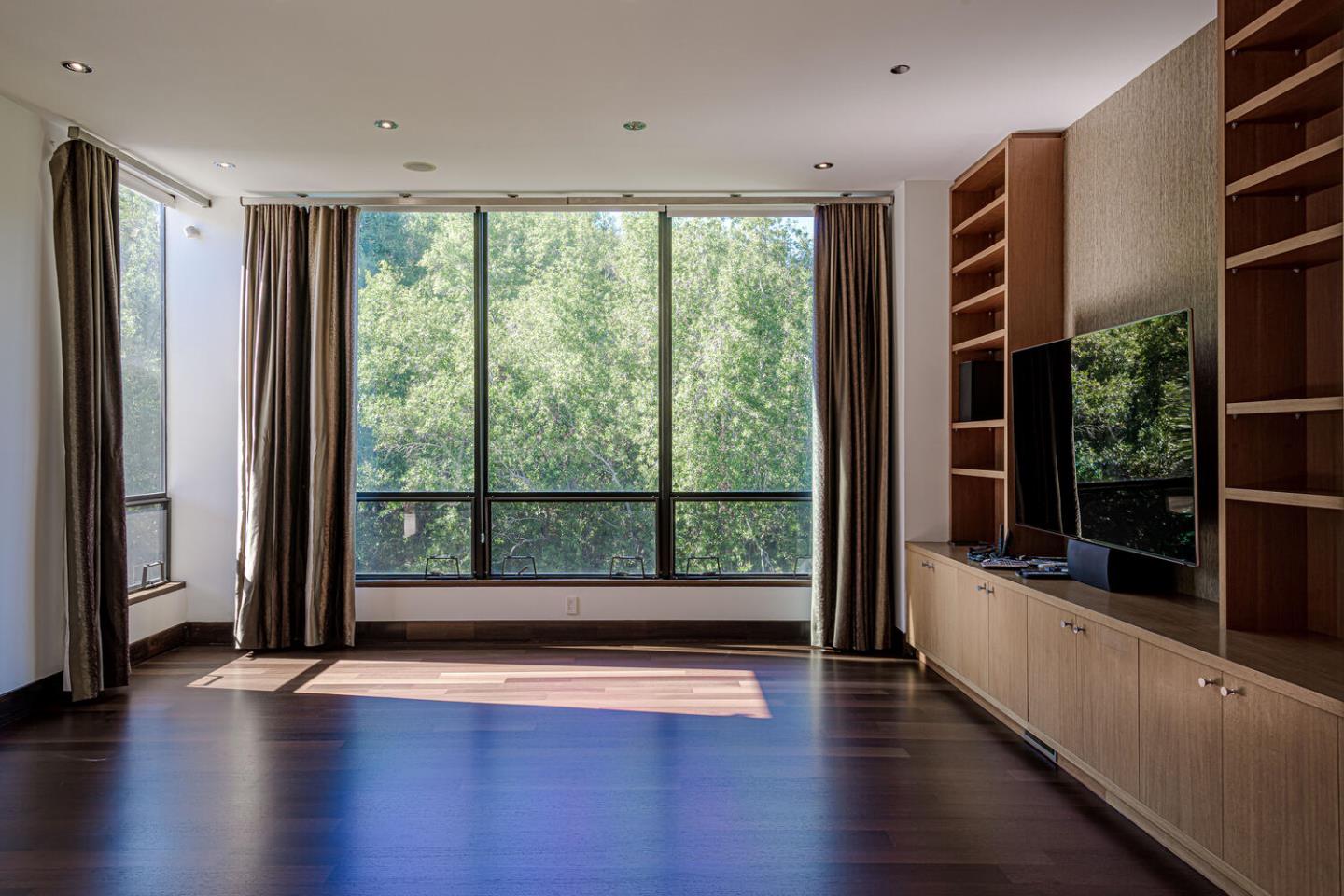 2510 Skyfarm Drive Hillsborough, CA 94010 - Photo 17 of 66 a view of a room with wooden floor and large window