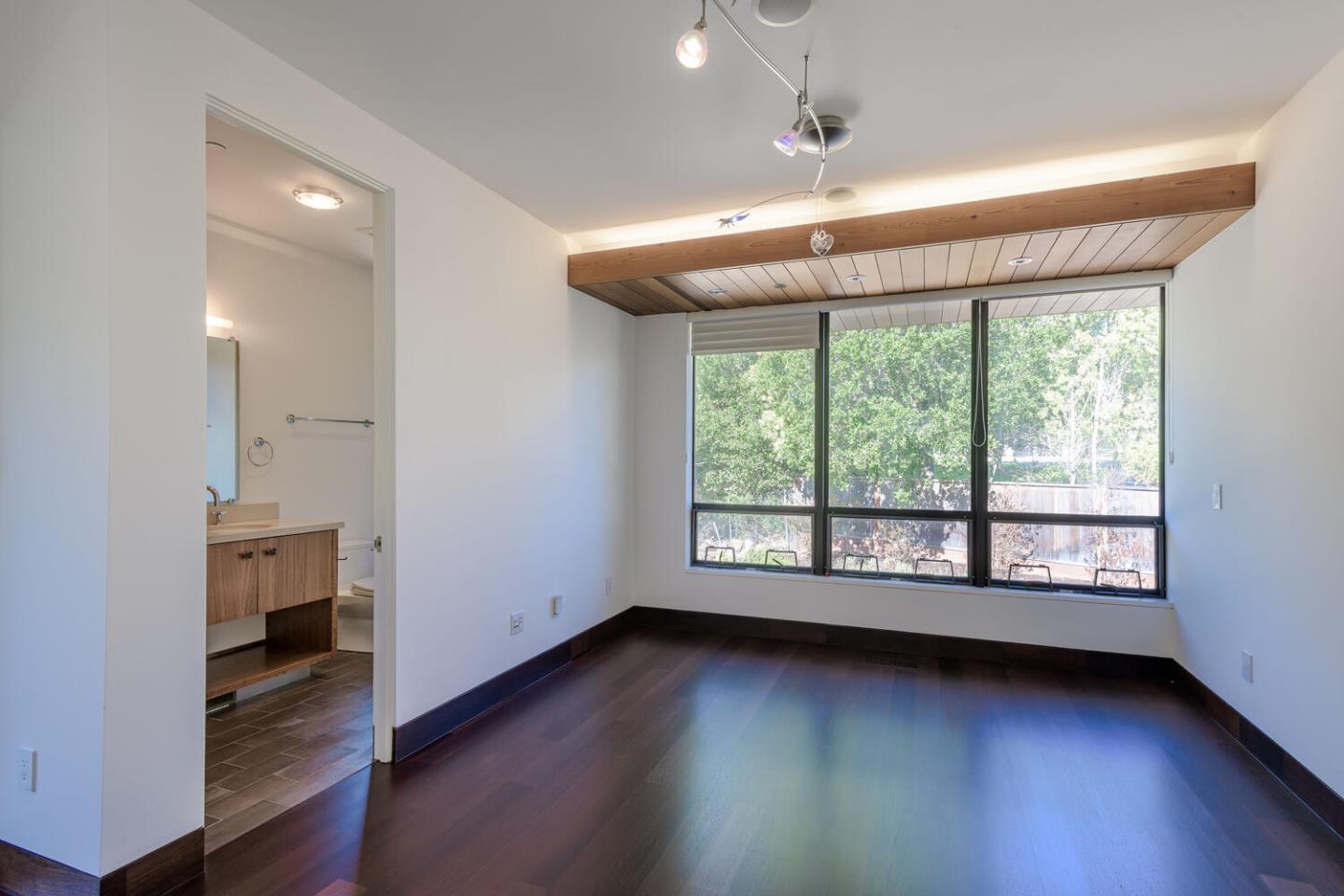2510 Skyfarm Drive Hillsborough, CA 94010 - Photo 26 of 66 a view of an empty room with wooden floor and a window