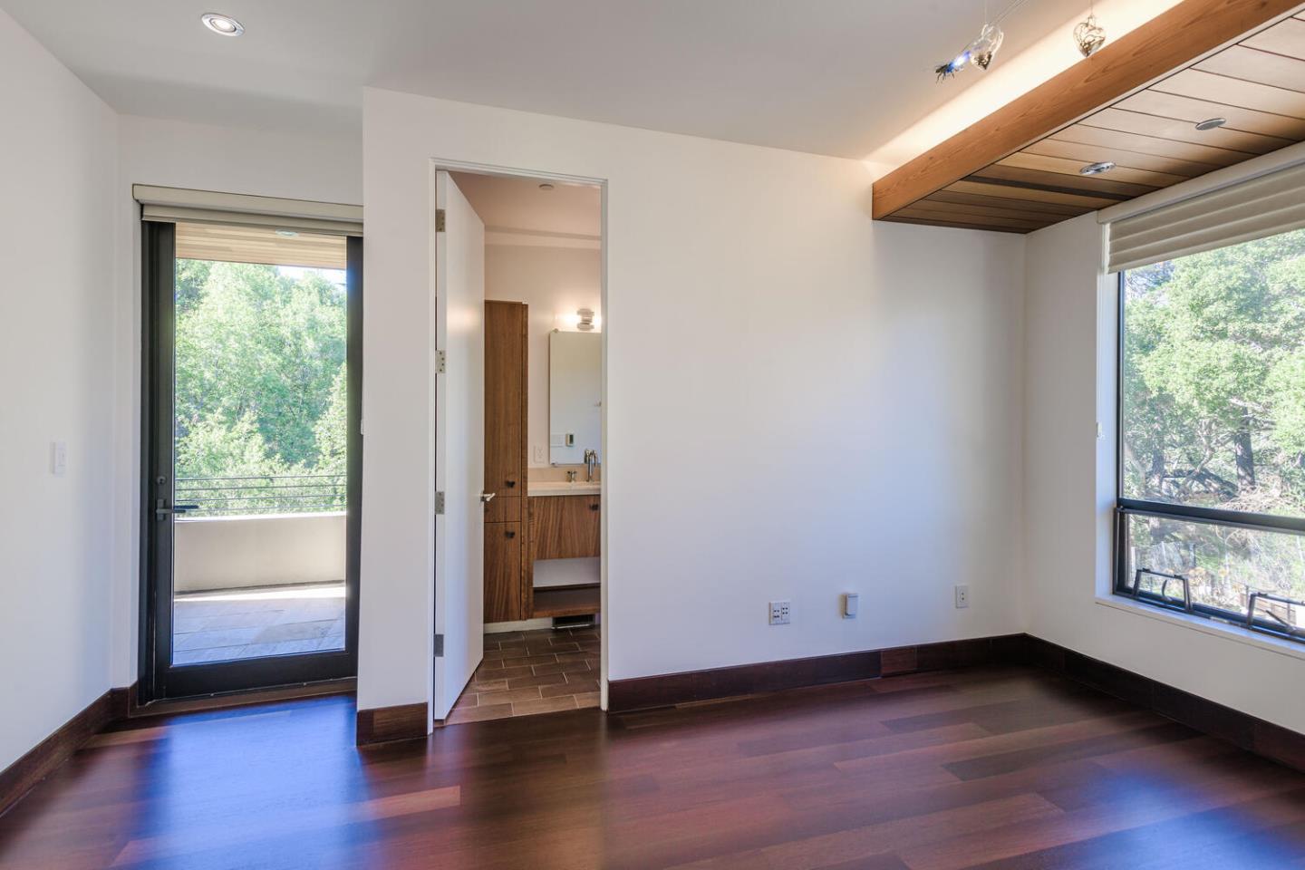 2510 Skyfarm Drive Hillsborough, CA 94010 - Photo 27 of 66 a view of an empty room with wooden floor and a window