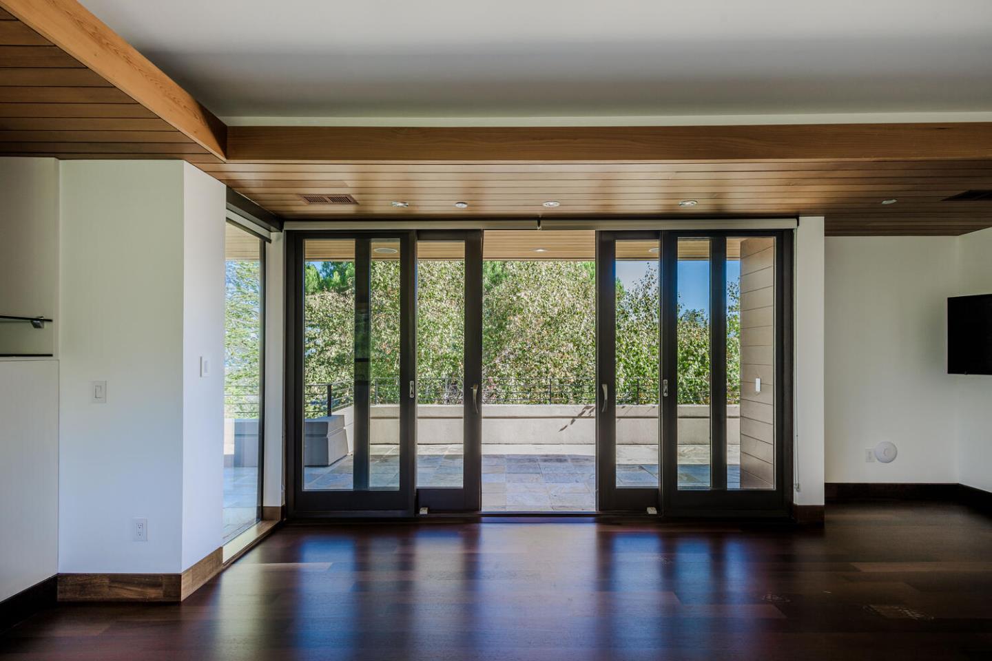 2510 Skyfarm Drive Hillsborough, CA 94010 - Photo 34 of 66 a view of an empty room with wooden floor and a window