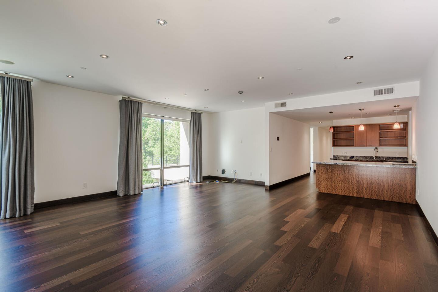 2510 Skyfarm Drive Hillsborough, CA 94010 - Photo 40 of 66 a view of an empty room with a window and wooden floor