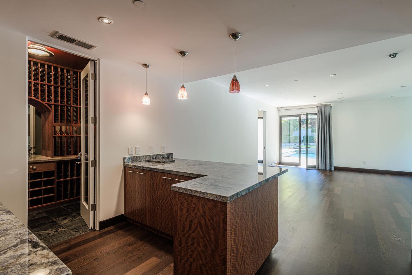2510 Skyfarm Drive Hillsborough, CA 94010 - Photo 41 of 66 a kitchen with granite countertop a stove and a refrigerator