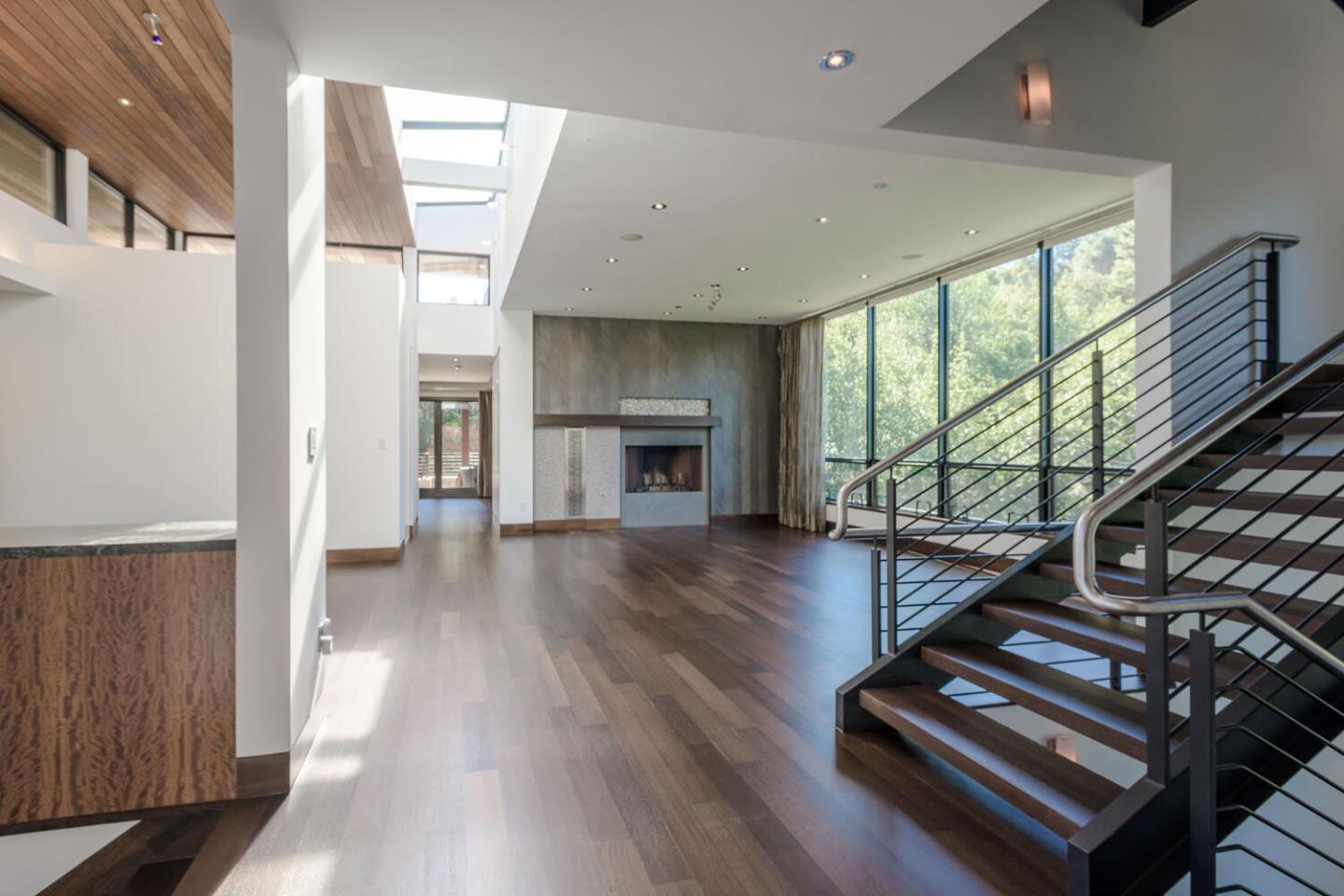 2510 Skyfarm Drive Hillsborough, CA 94010 - Photo 6 of 66 a view of an entryway with wooden floor fireplace and windows
