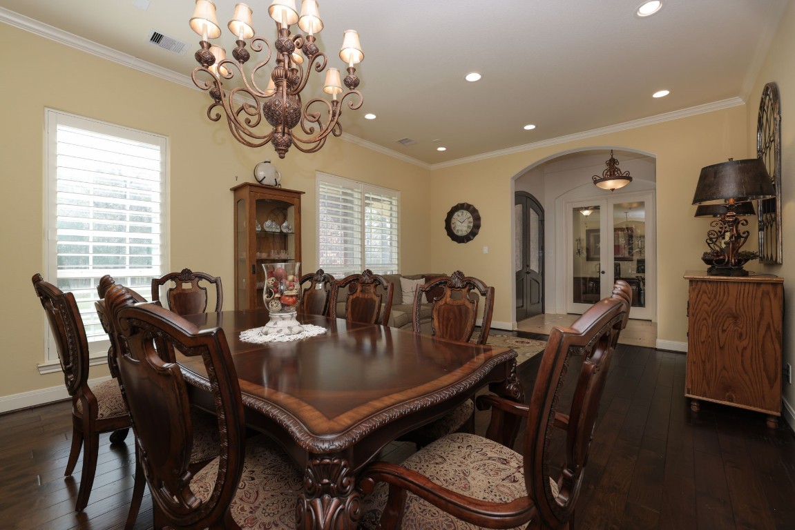 1547 Ruby Drive Willis, TX 77378 - Photo 11 of 45 a view of a dining room with furniture and chandelier