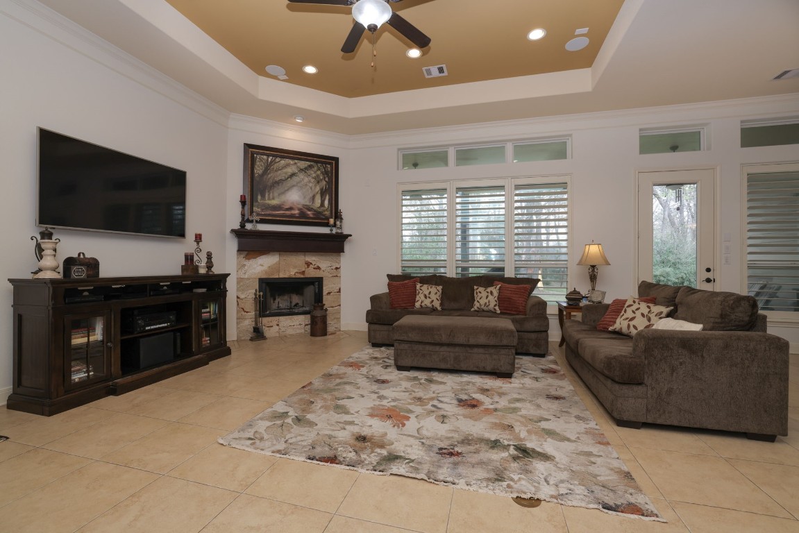 1547 Ruby Drive Willis, TX 77378 - Photo 13 of 45 a living room with furniture a flat screen tv and a fireplace