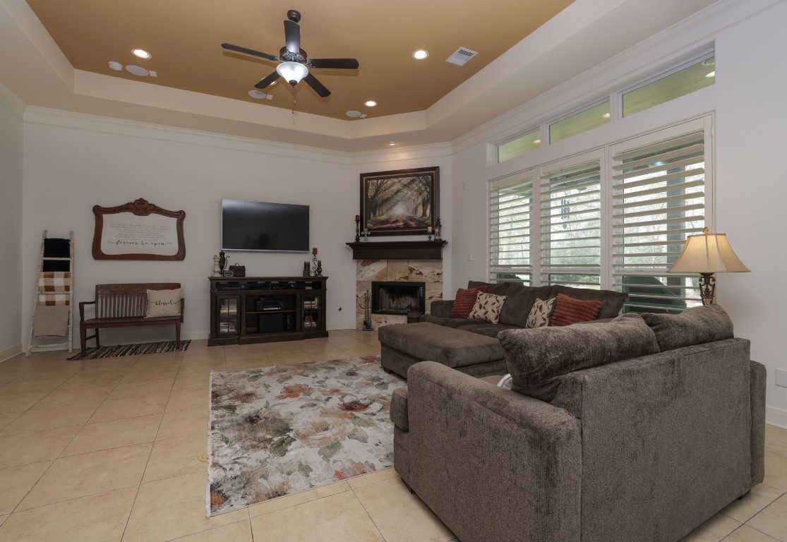 1547 Ruby Drive Willis, TX 77378 - Photo 14 of 45 a living room with furniture a fireplace and a flat screen tv