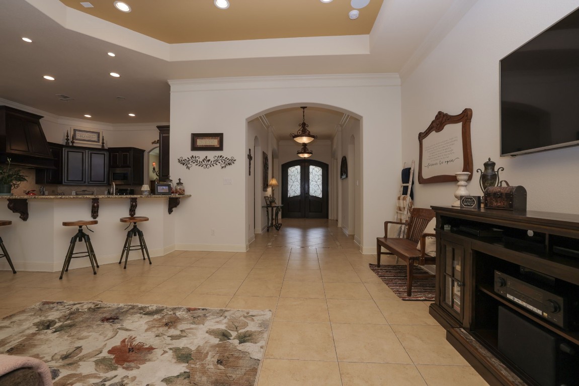 1547 Ruby Drive Willis, TX 77378 - Photo 15 of 45 a living room with stainless steel appliances furniture and a flat screen tv