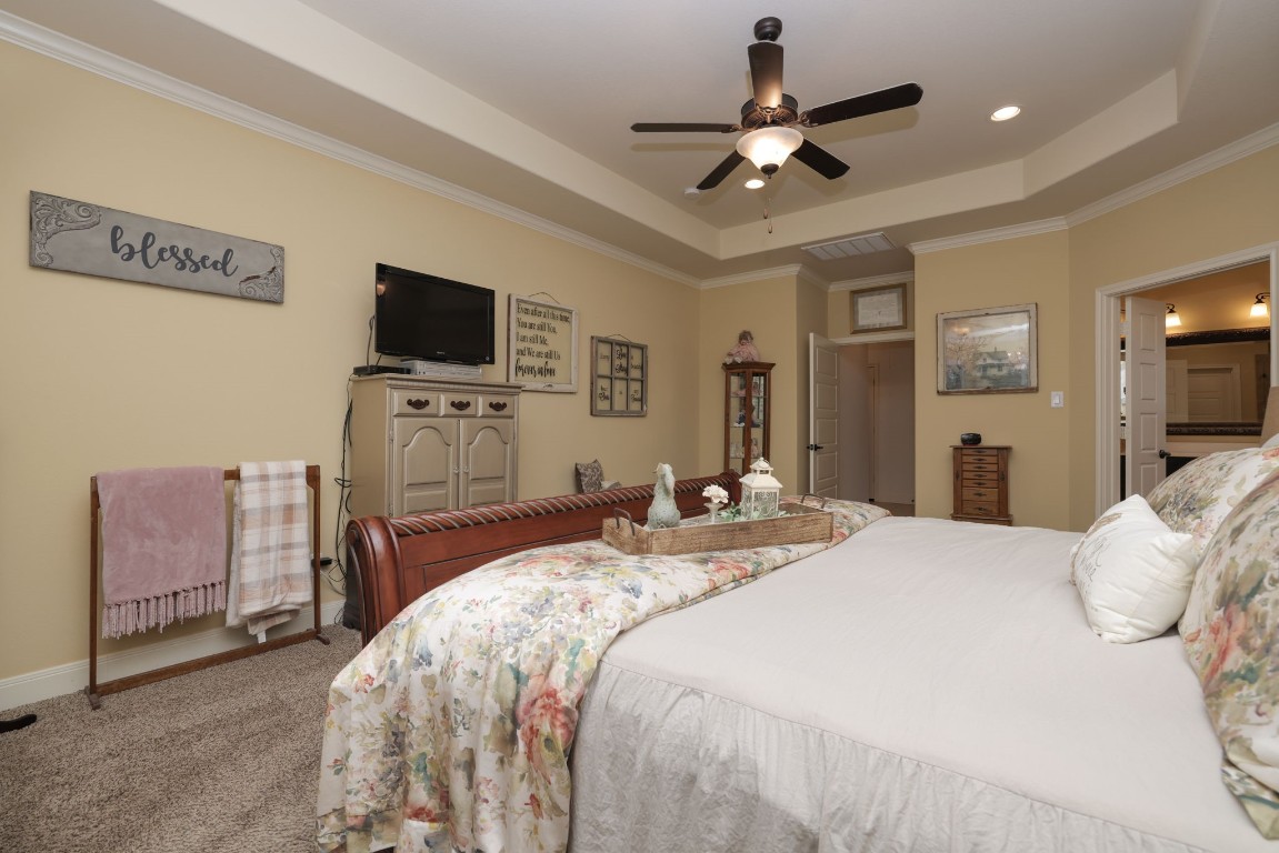 1547 Ruby Drive Willis, TX 77378 - Photo 22 of 45 a bedroom with a bed and a flat screen tv