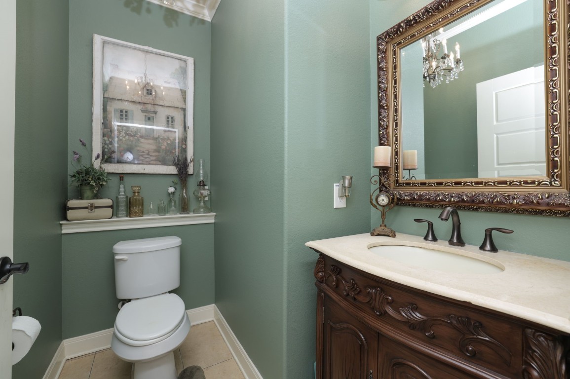 1547 Ruby Drive Willis, TX 77378 - Photo 30 of 45 a bathroom with a toilet sink and mirror