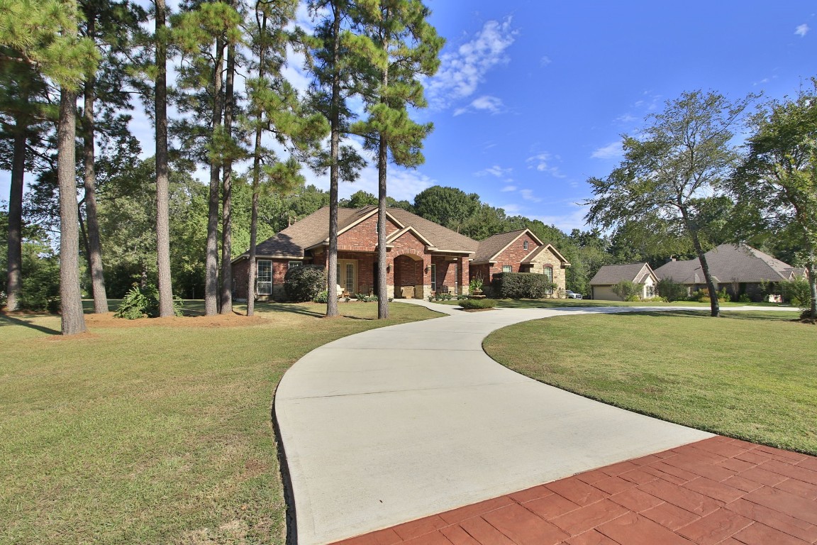 1547 Ruby Drive Willis, TX 77378 - Photo 3 of 45 a view of outdoor space yard and tree