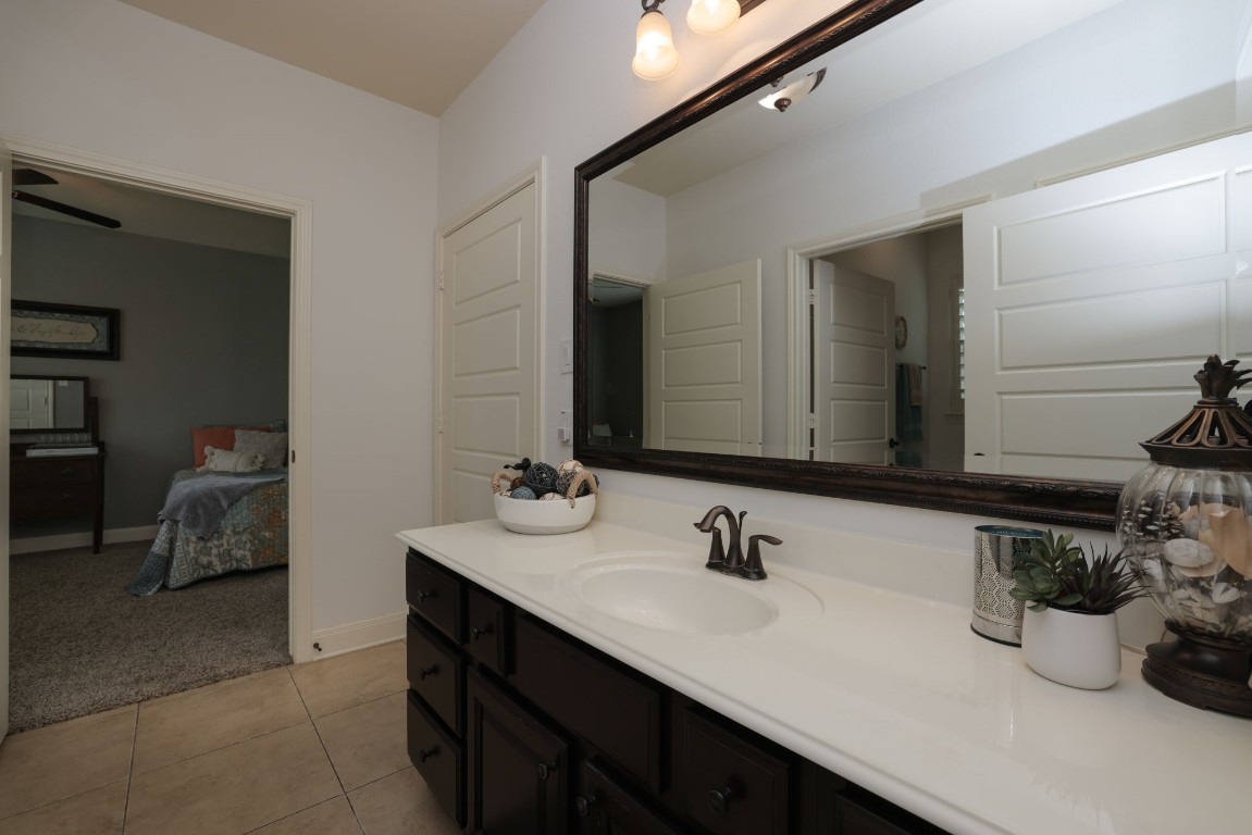 1547 Ruby Drive Willis, TX 77378 - Photo 35 of 45 a bathroom with a sink double vanity and a mirror