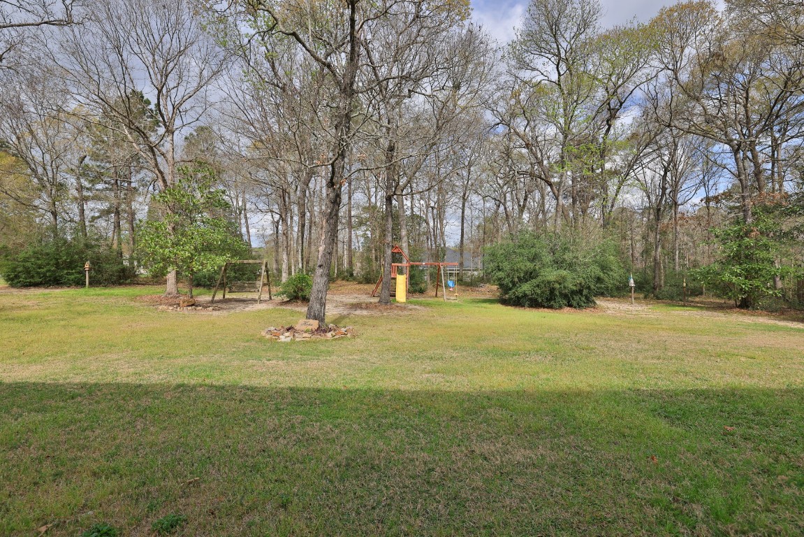 1547 Ruby Drive Willis, TX 77378 - Photo 38 of 45 a view of yard with tree
