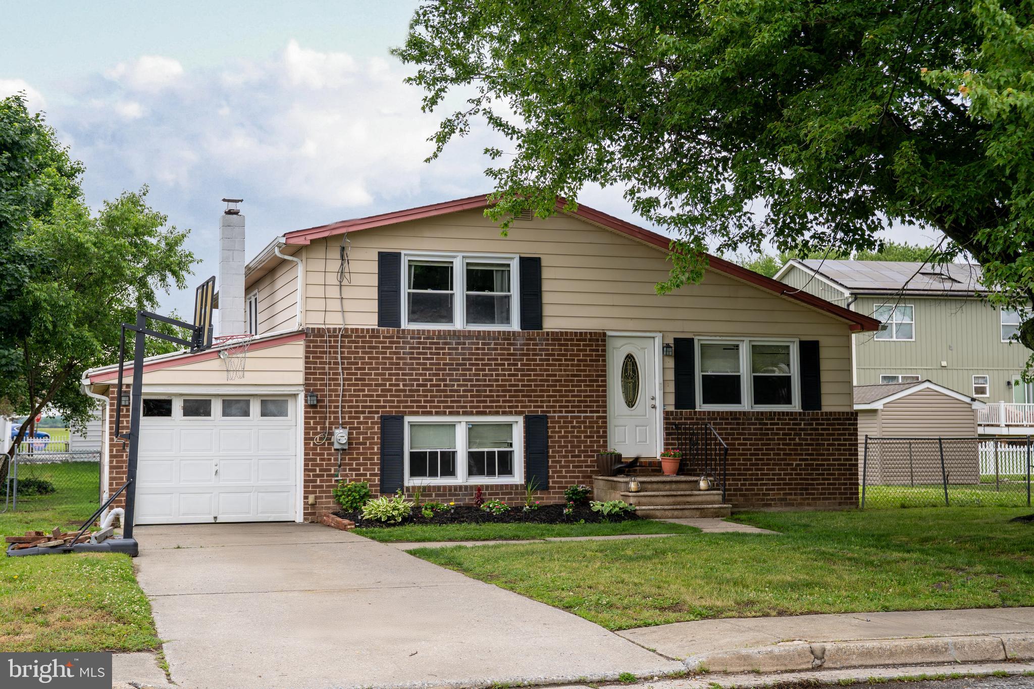 174 Kansas Road Pennsville, NJ 08070 - Photo 1 of 22 a front view of house with yard and green space